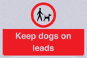 dogs-on-lead-symbol-with-black-text-on-white-background~